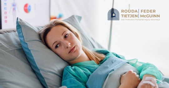 Woman laying in hospital bed.